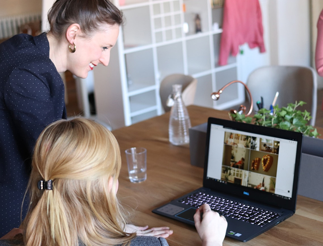 Two women looking at laptop